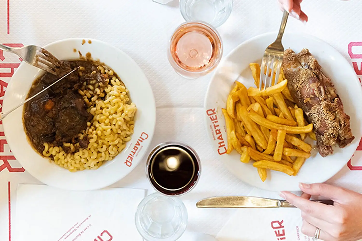 Bouillon Chartier signature dishes Oeuf Mayonnaise (Egg with Mayonnaise)Steak Frites (Steak with Fries)Confit de Canard (Duck Confit)Poireaux Vinaigrette (Leeks with Vinaigrette)